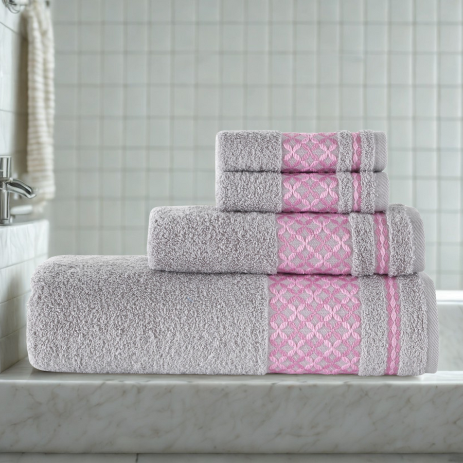 Gray and pink patterned towels on a bathroom counter