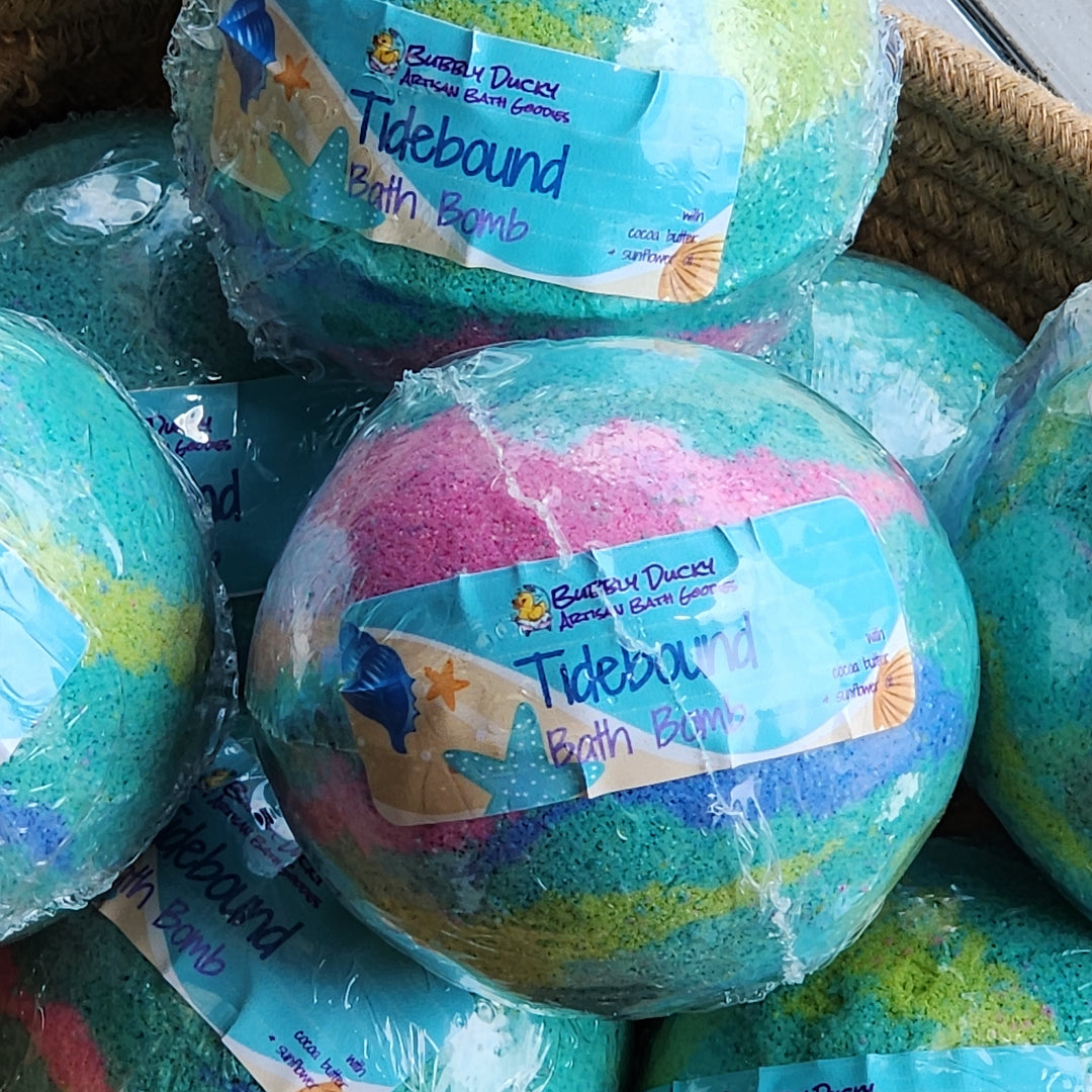 Colorful bath bombs with visible labels in a basket