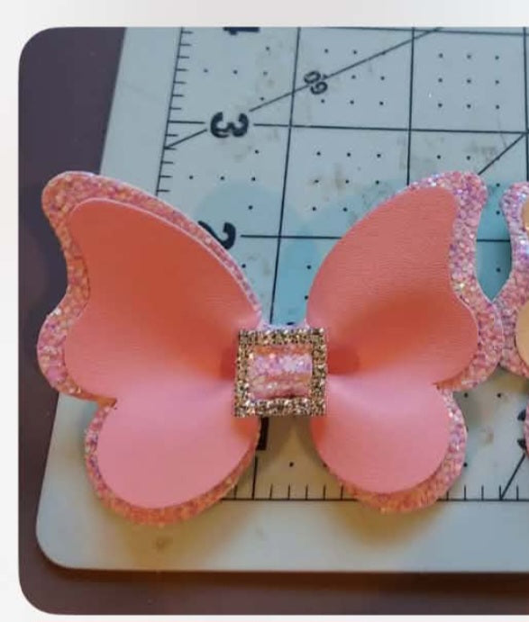 Pink butterfly rhinestone bow